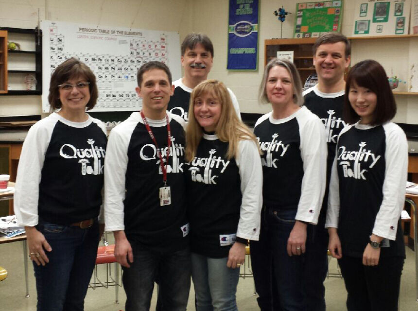 Group of Quality Talk facilitators in Quality Talk shirts.